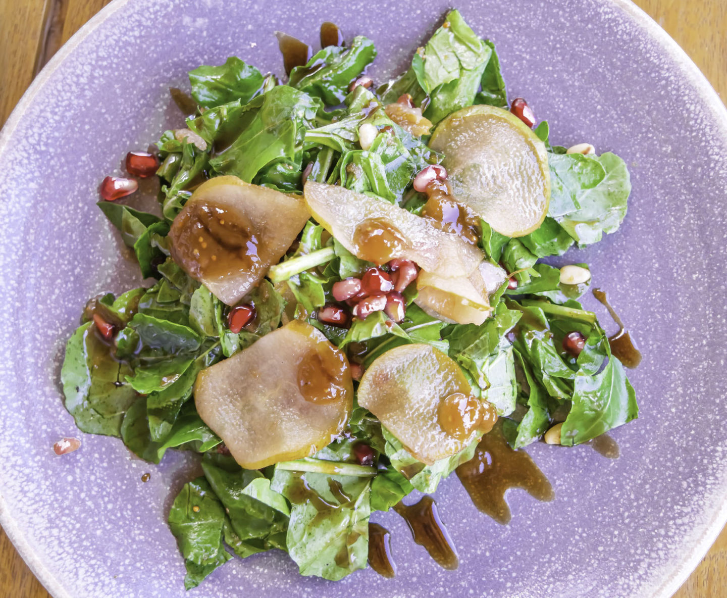 Arugula Salad with marinated pear, tofu, walnuts, tossed with pomegranate vinaigrette sauce, sprinkled with Carob honey at Mitsis Alila Resort and Spa in Rhodes, Greece while on the perfect vacation on the Mediterranean