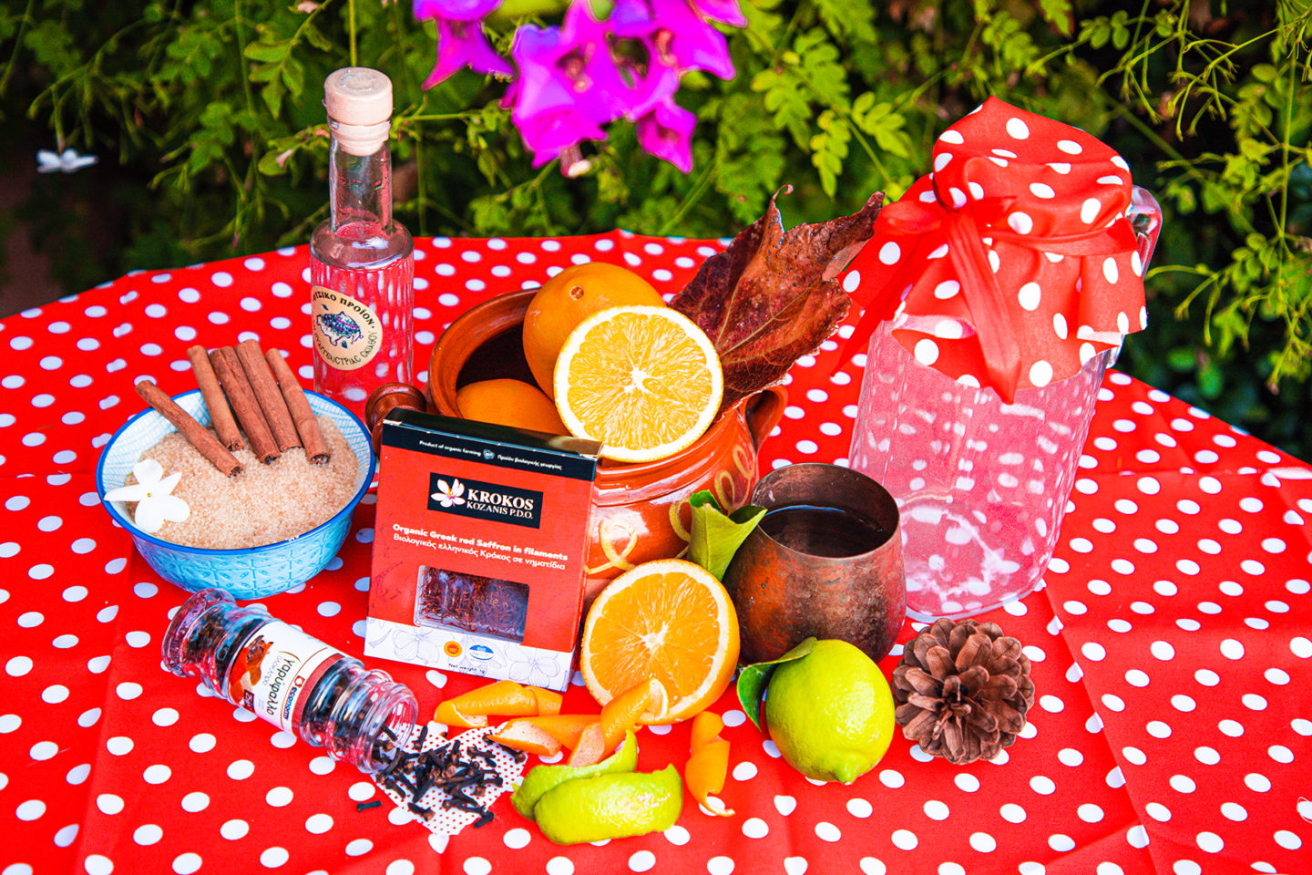 Ingredients for homemade greek tsipouro cinnamon orange liquor with oranges and peels and Krocus Kozanis, and clove for your liqueur