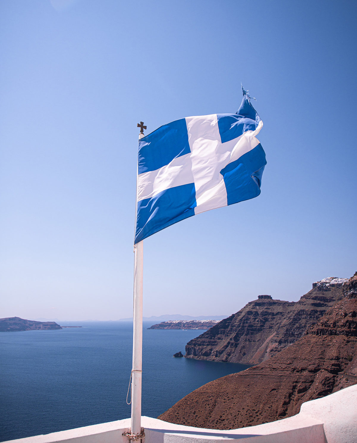 Aghios Minas cHurch in Santorini, Thera, The Greek flag. One of the best instagram photo spots in Santorini with Anna Myrha