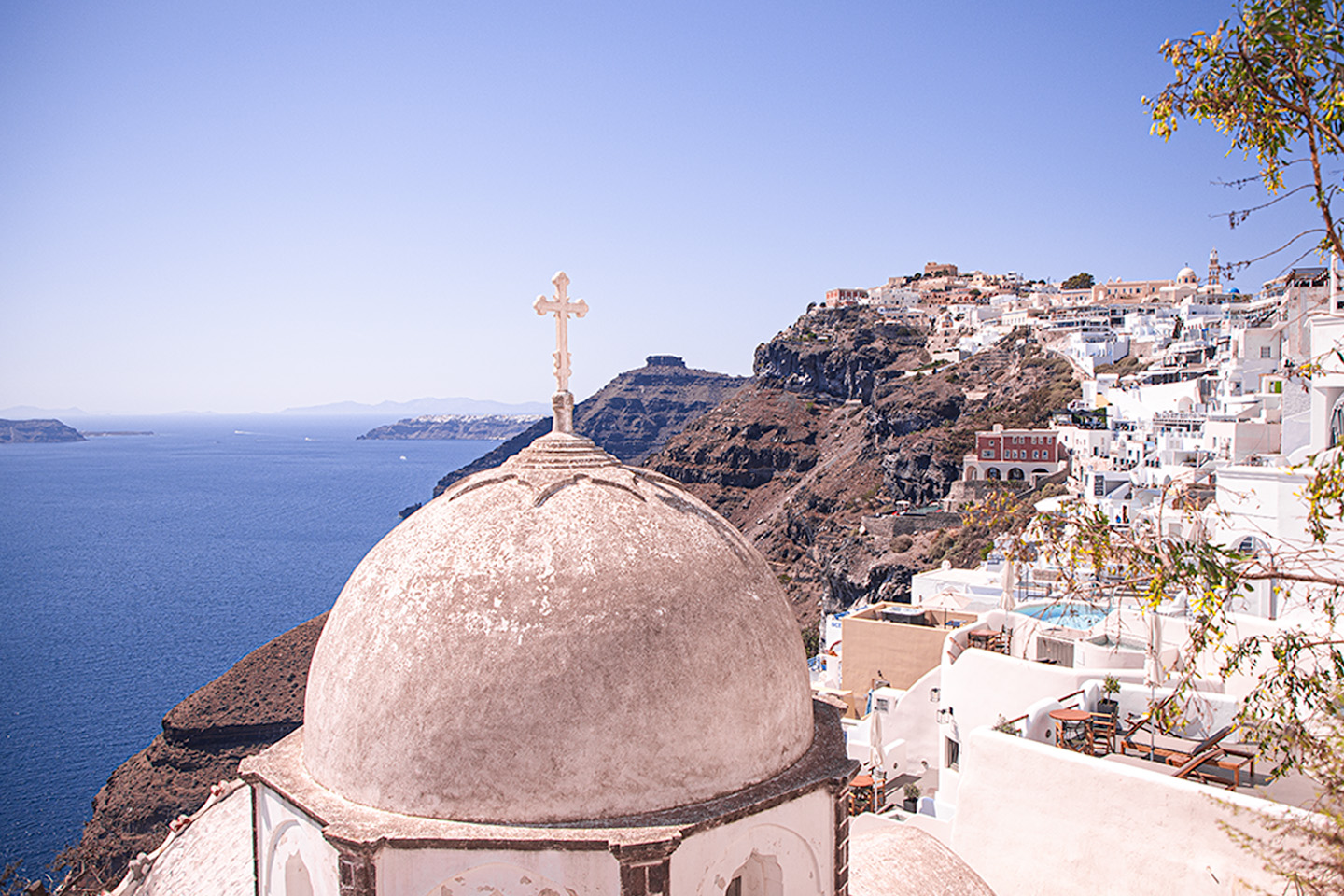 Fira  or Thera in Santorini, Greece, a view from a Greek Church dome by Anna Myrha for The Ultimate Santorini Photo Guide blog post