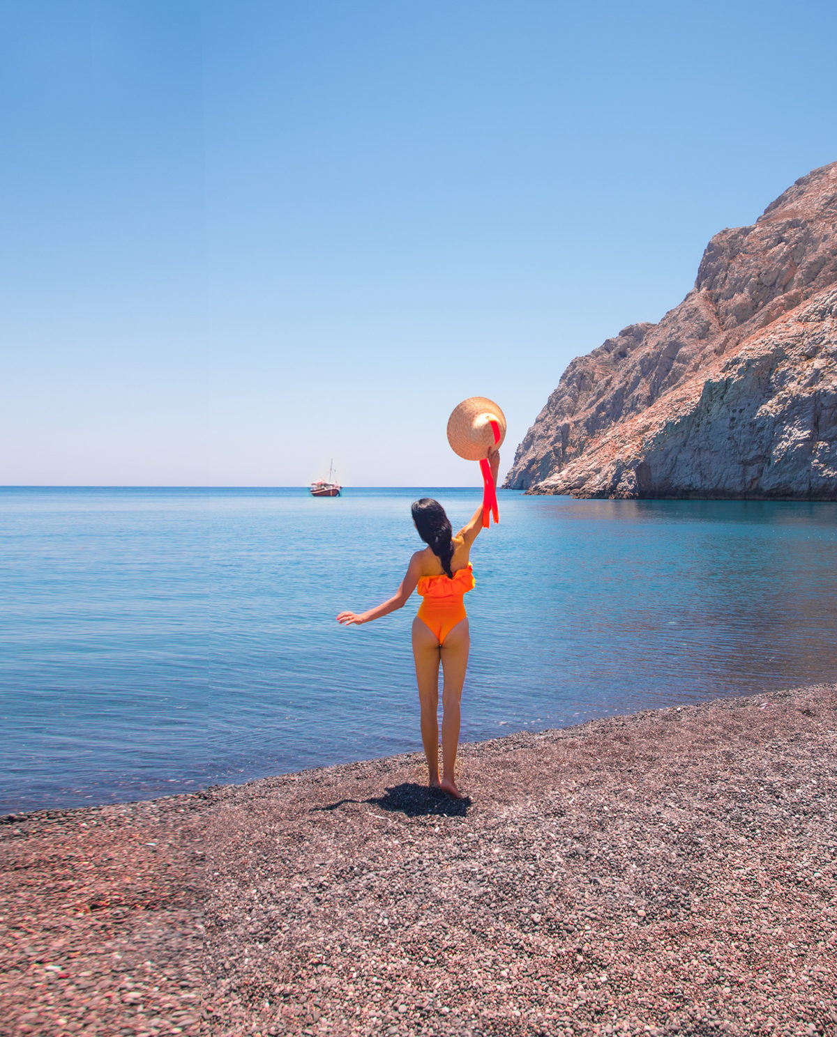 The volcanic beach of Kamariis one of the best photo spots in Santorini, with Anna Myrha, Greece. By Travel to a Fairytale with Anna Myrha 