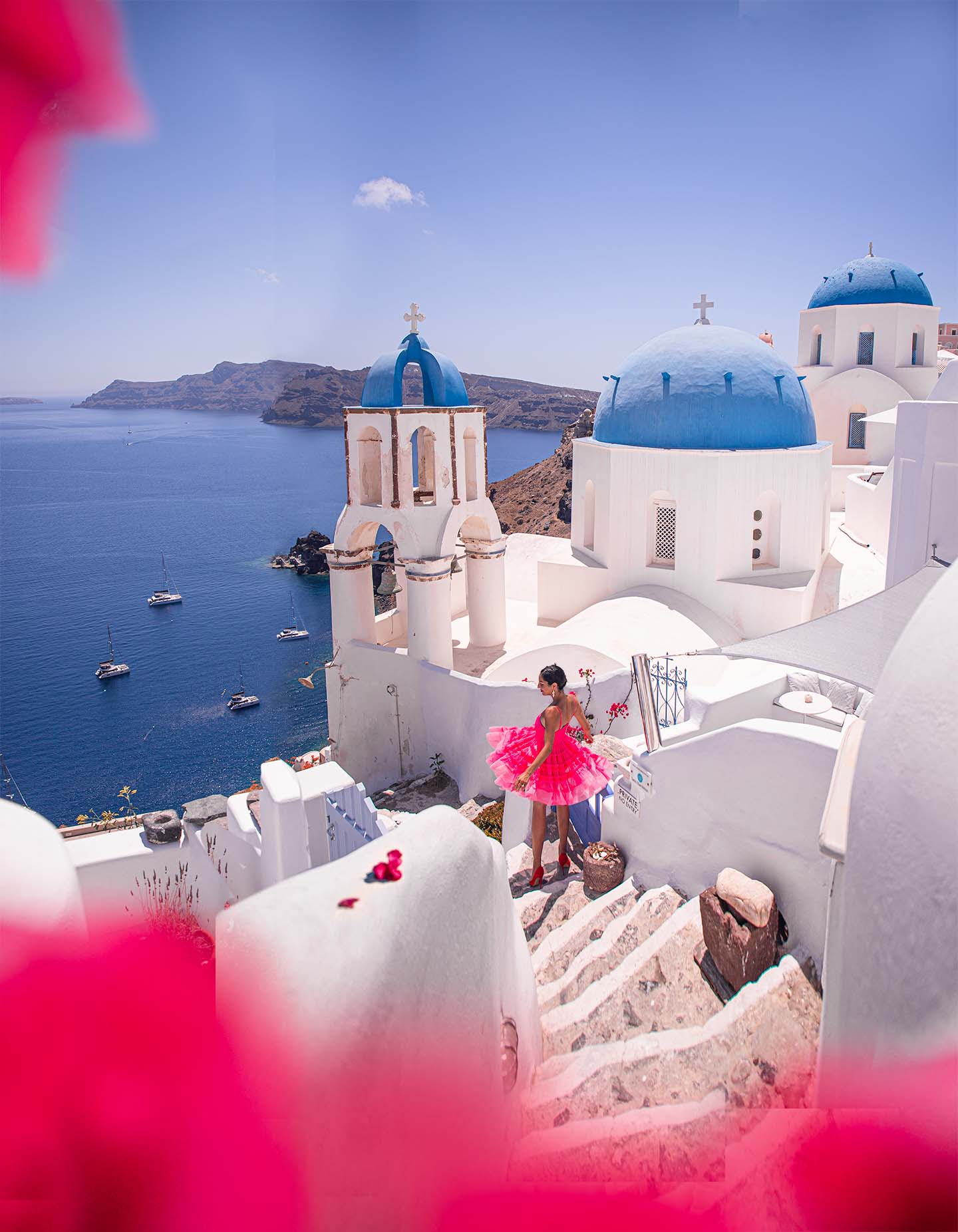 The Three Blue Domed Churches of Oia, in Santorini, with Anna Myrha from Travel to a fairytale trael Blog in Greece