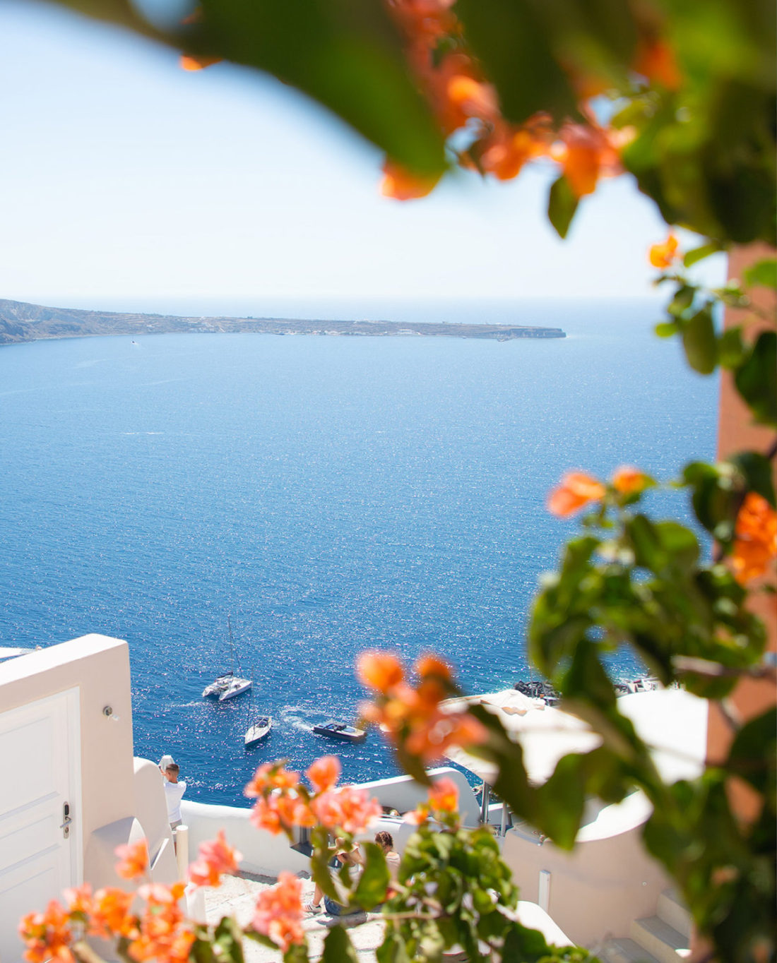 One of the best Inastagram photo spots in Santorini, Oia, an orange house with Anna Myrha