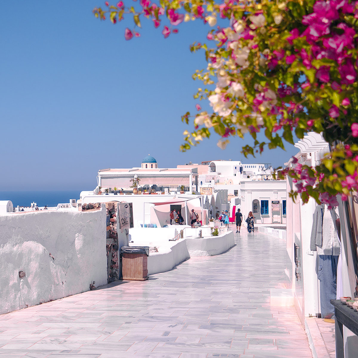 The main street of Oia, empty from crowds on a weekday morning in early June by Anna Myrha, Travel to a Fairytale