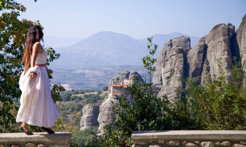 A stunning view of St. Nicholas Anapausas Monastery from the base of Rousanou's cliff.